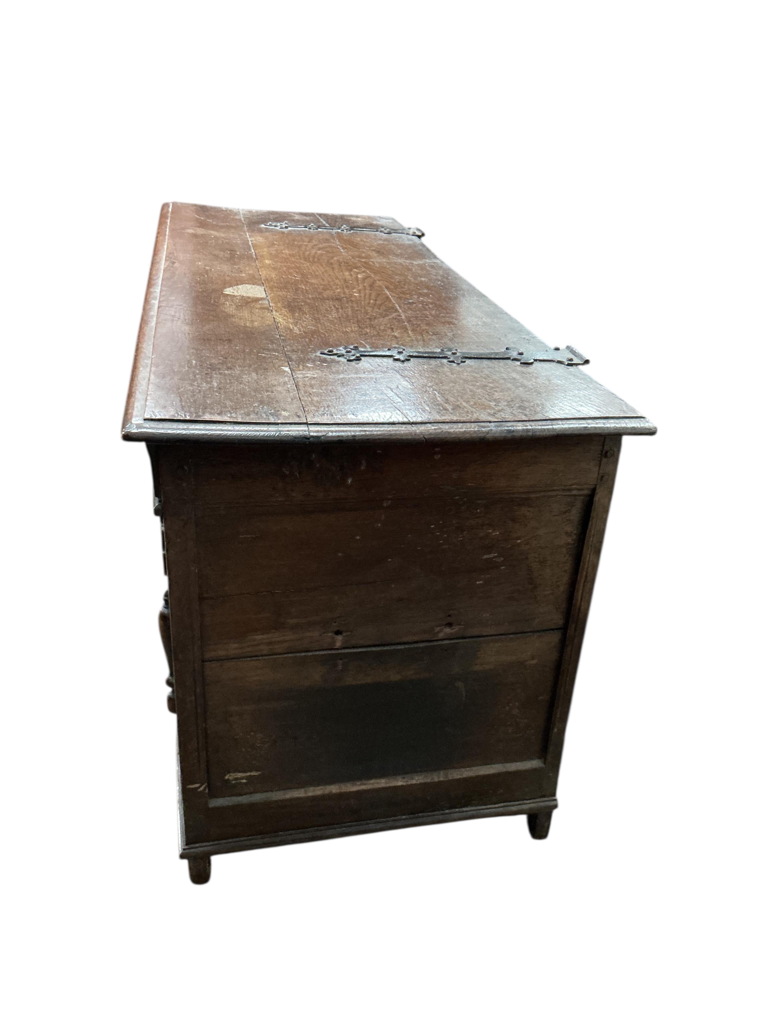An 18th century oak coffer, width 129cm, depth 53cm, height 66cm